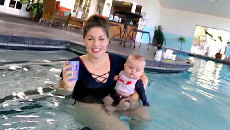 A baby being prepared for swimming lessons
