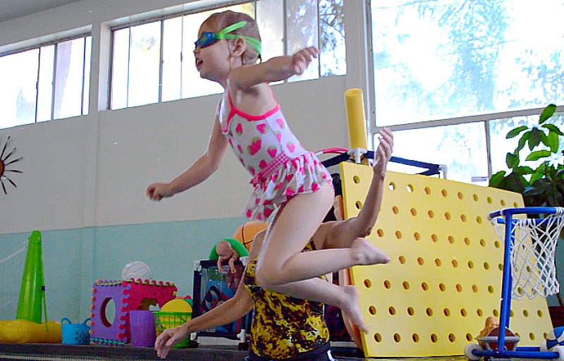 Teach your child how to jump into a pool safely.